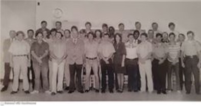 Black and white photograph of a large group of law enforcement trainees and instructors posing together, showcasing early law enforcement training at Pensacola Junior College.