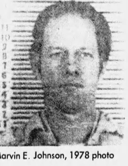 Black and white mugshot of a man identified as Marvin E. Johnson, taken in 1978, featuring a serious expression against a striped backdrop.